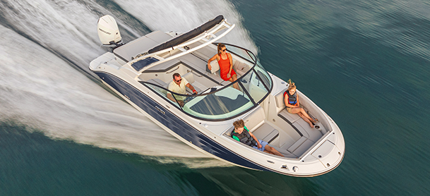 4 boaters ripping on the water on a small boat