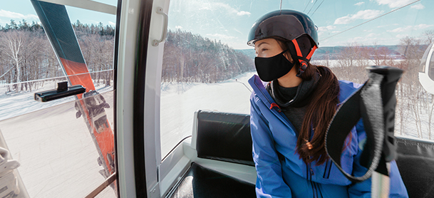 Woman in a mask at a ski resort
