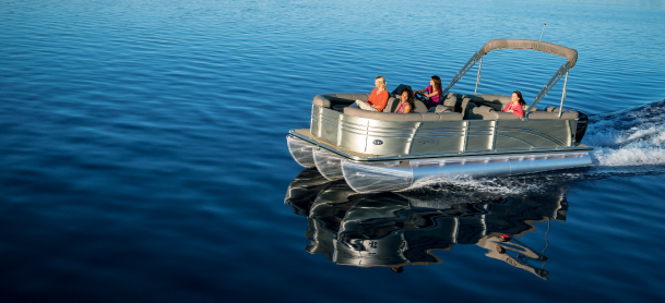 Family having fun on a pontoon boat out on the water