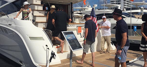 people taking off their shoes boarding a boat