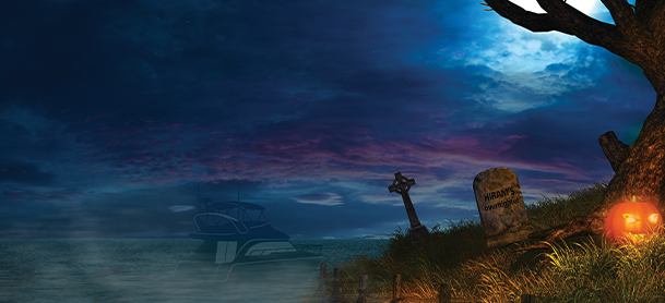 A boat in the water at night under the moon