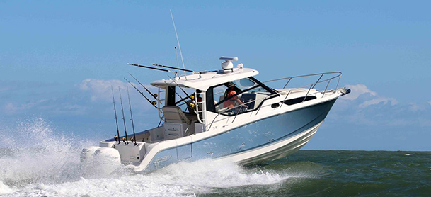 A Boston Whaler 325 Conquest cruising through open water
