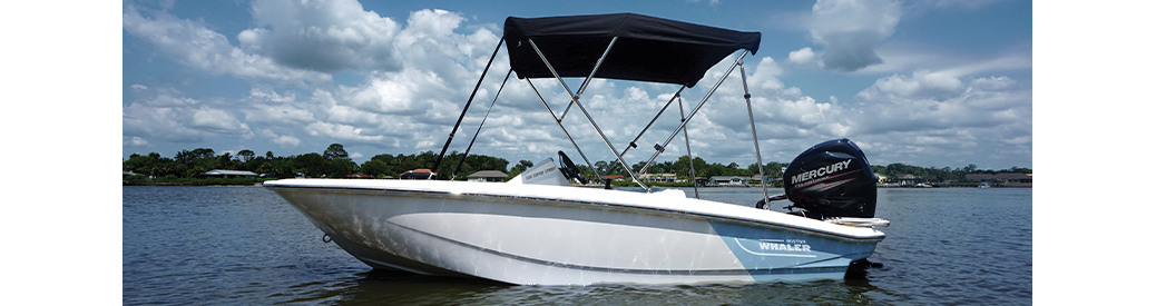 A side view of a Boston Whaler boat in the water