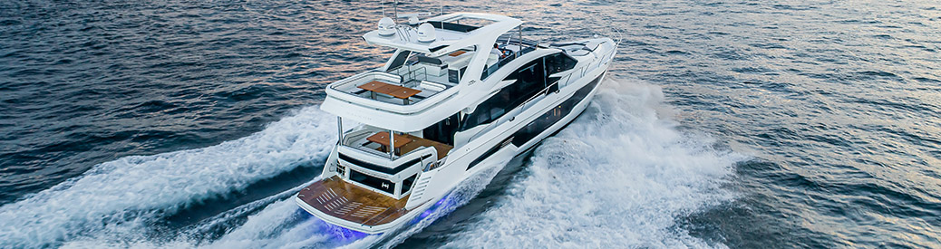 A Galeon 680 Fly cruising through open blue water