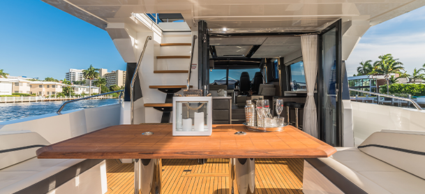 A view of a table, stairs, and interior of a Galeon 680 Fly