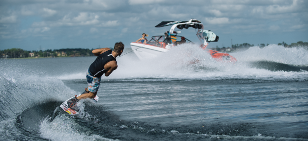 A man wakeboarding behind a boat