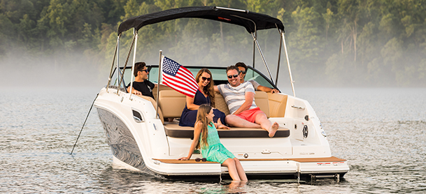 A family aboard an anchored boat