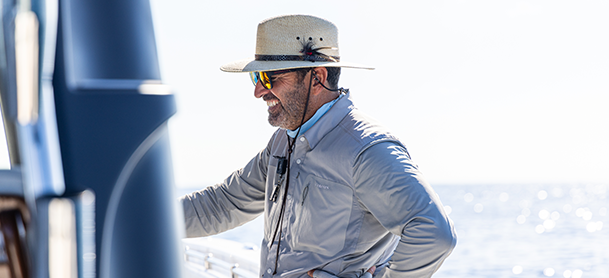 A boater wearing breathable clothing to stay cool