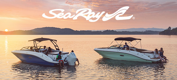 Two Sea Ray boats on the water with the Sea Ray logo at sun set