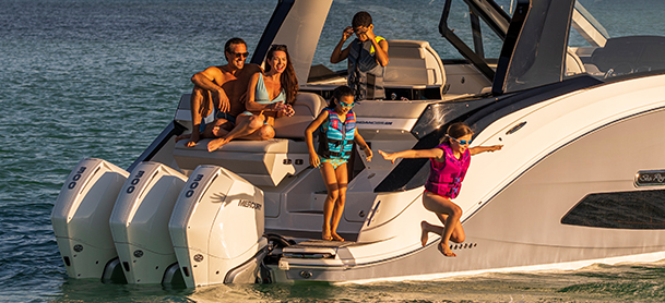 Family jumping off a boat