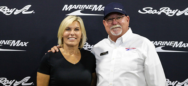 Captain Sandy and Captain Keith in front of MarineMax background 