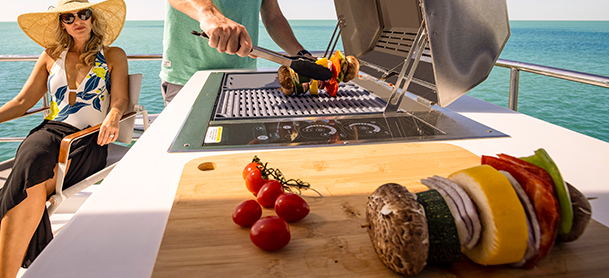 Group of people cooking on an Aquila