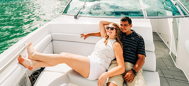A couple lounging on a boat
