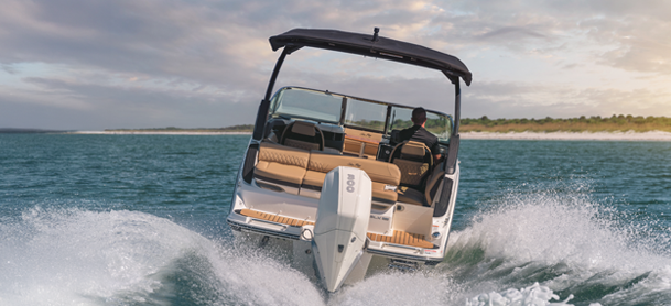 A bow rider boat ripping up the water