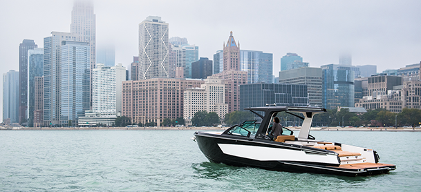 A boater on an Aviara observing the city skyline from the water