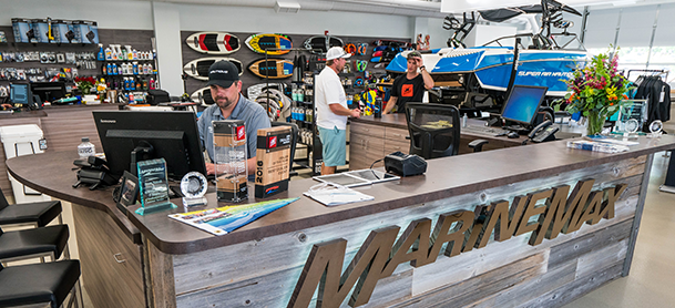 bustling marinemax shop interior with people browsing water sports equipment
