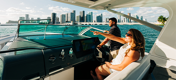 man and woman cruising on a boat