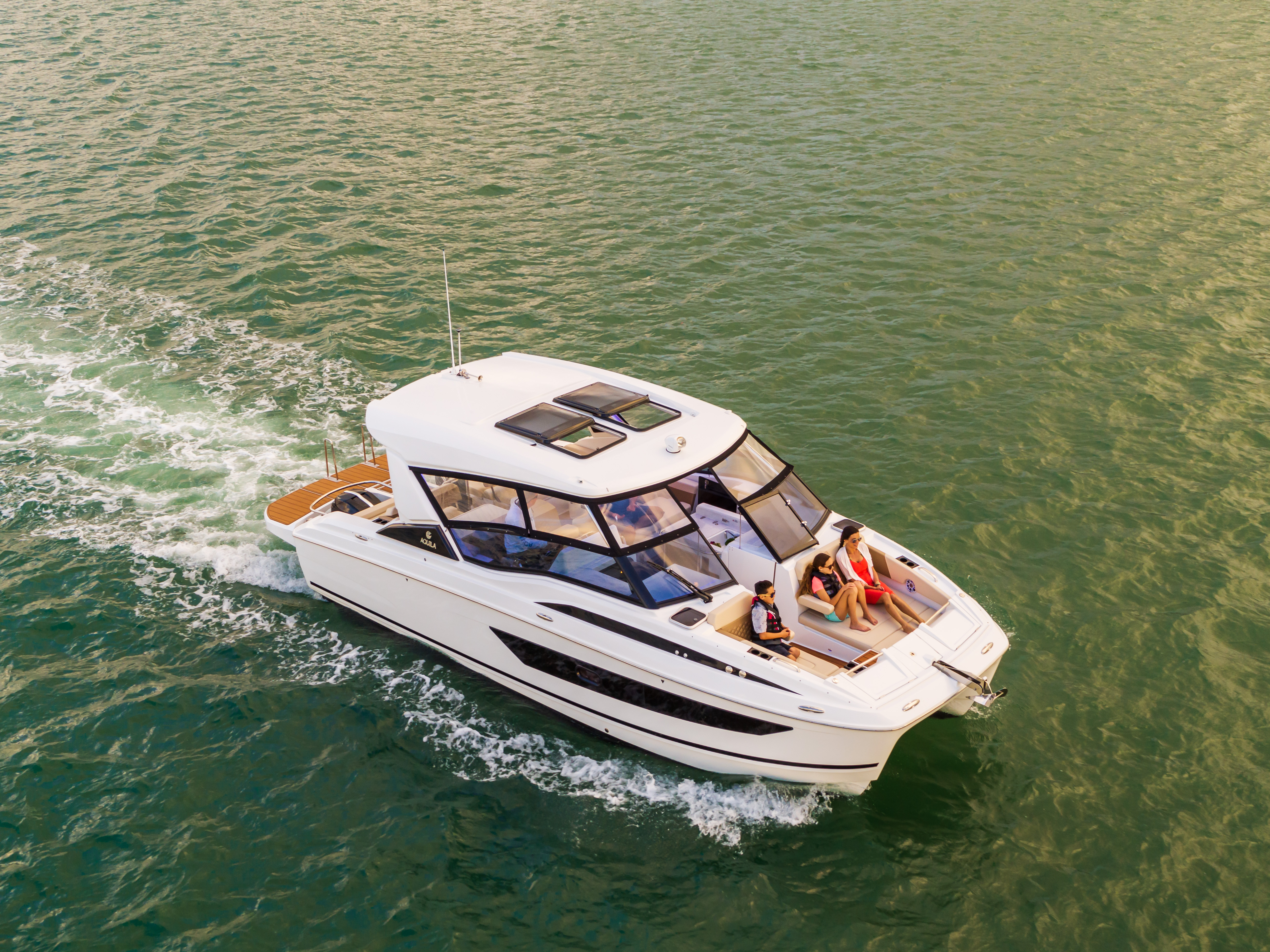 People enjoying deck on power catamaran