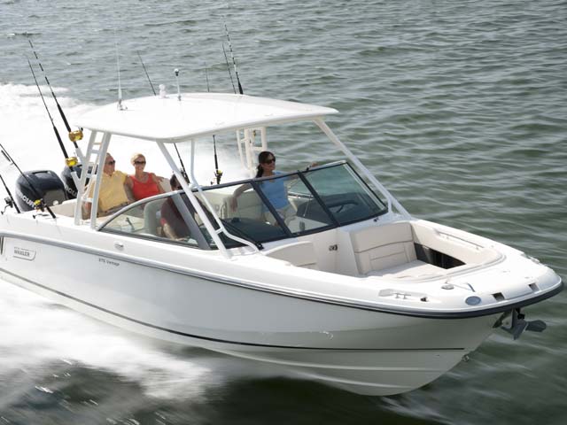 Dual console boston whaler with group traveling out to fish