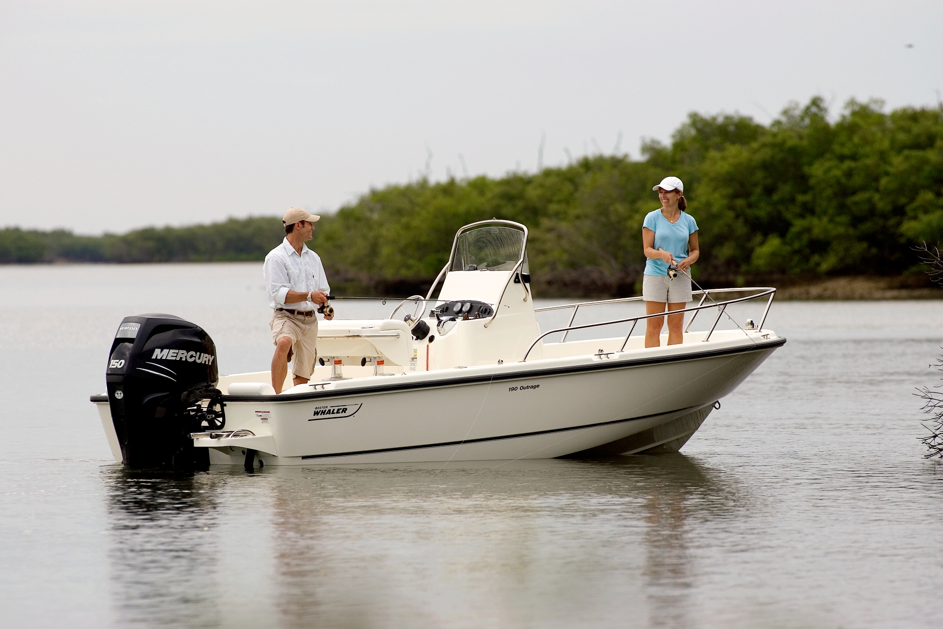 A couple enjoys an afternoon fishing inshore on their boat