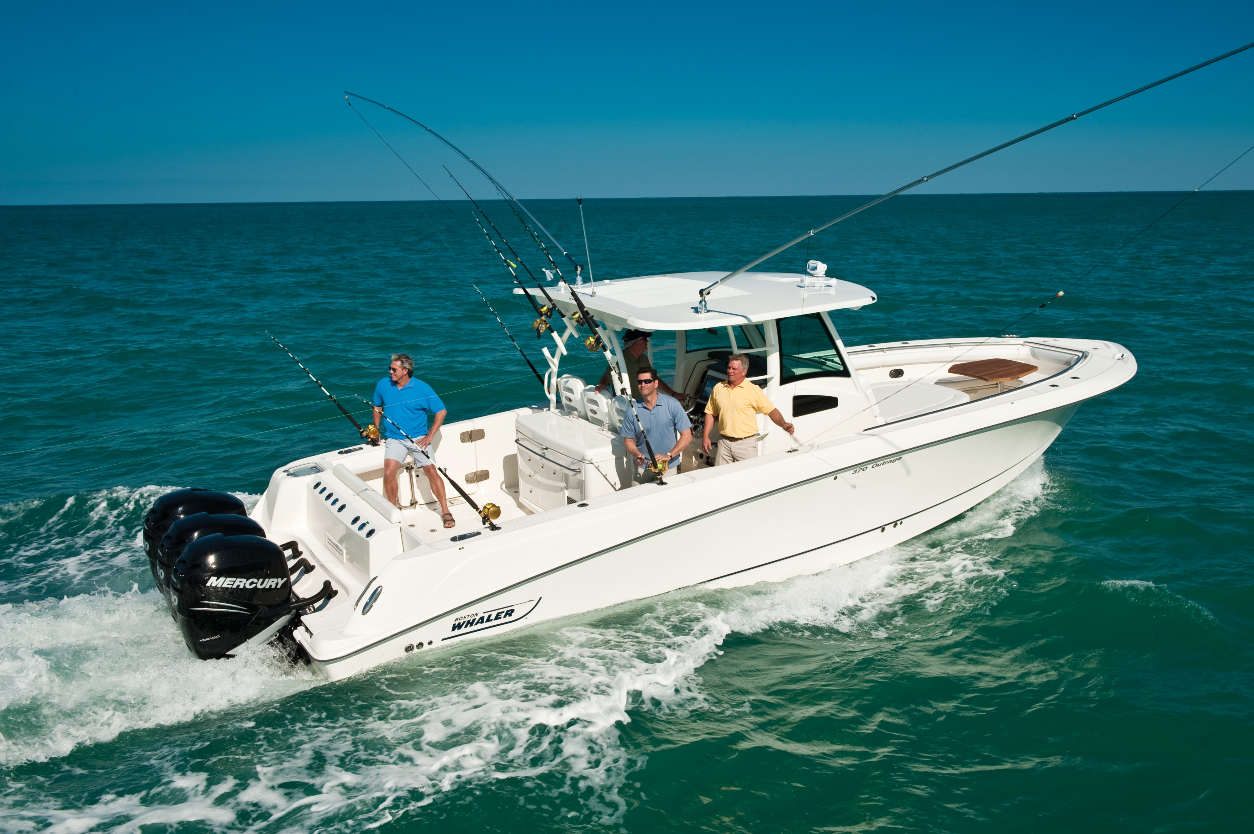 Group on an offshore fishing boat heading out to fishing spot