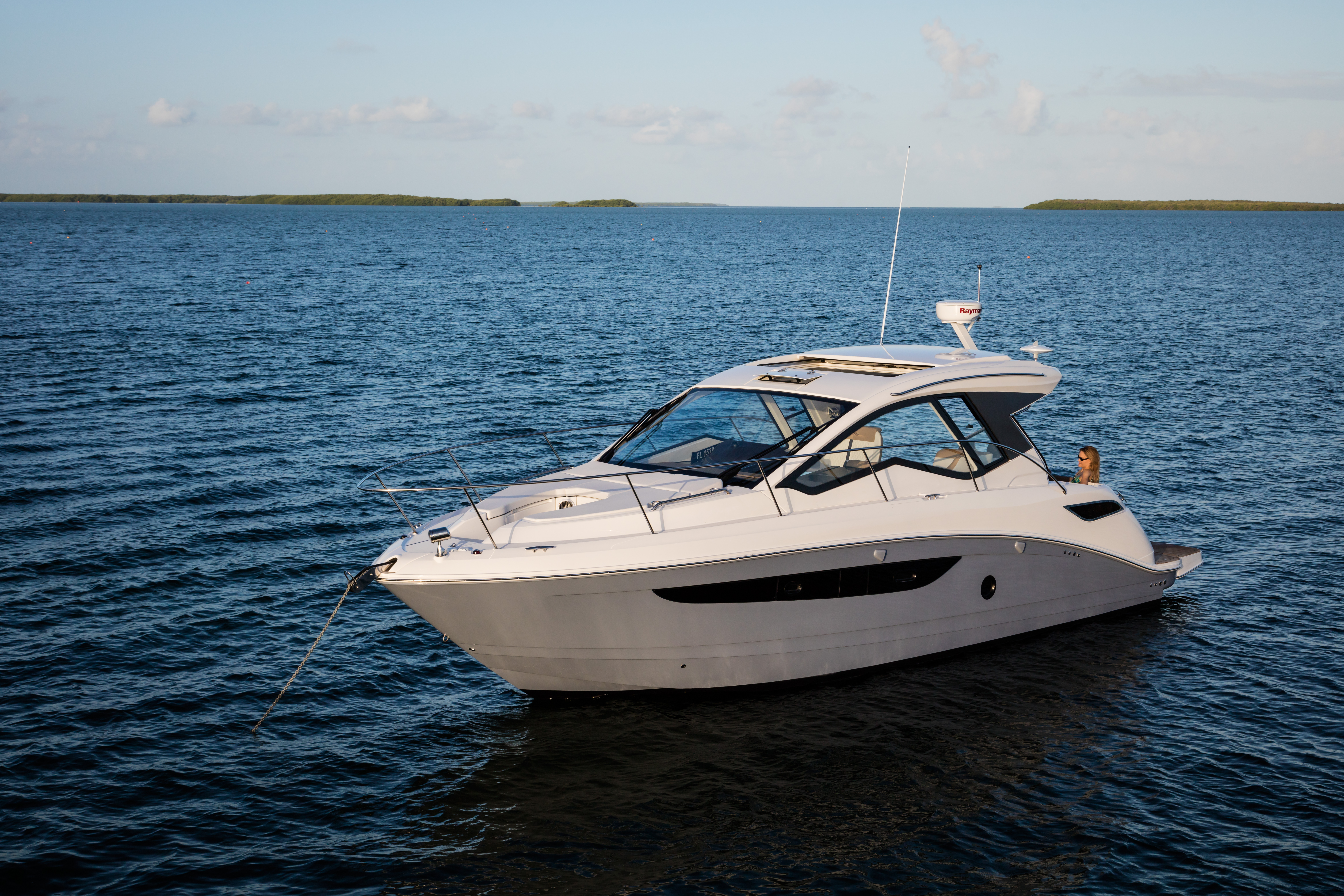 Searay cabin cruiser anchored on the water