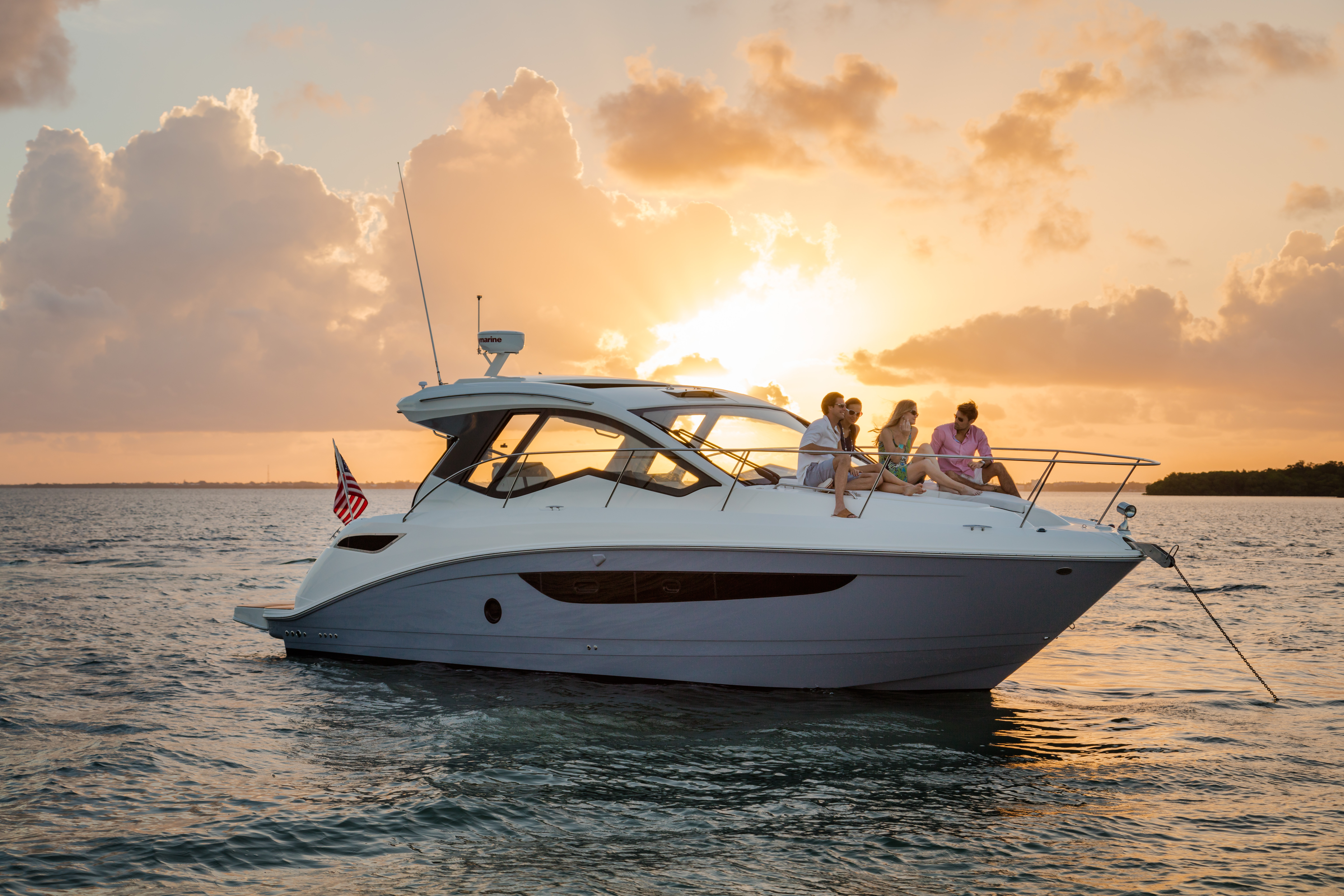 Searay cabin cruiser anchored during sunset