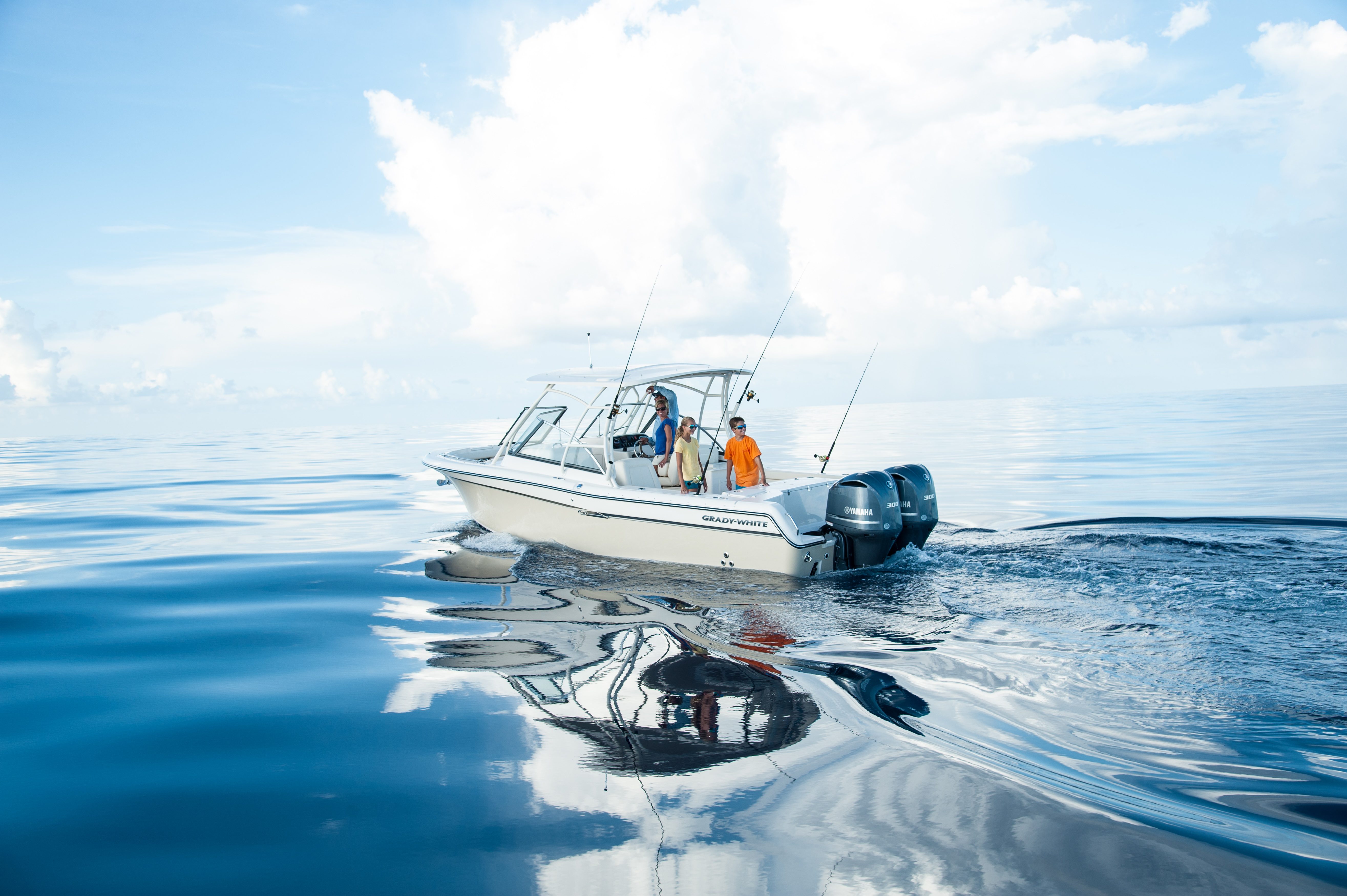 Offshore fishing boat slowly cruising on glass water 