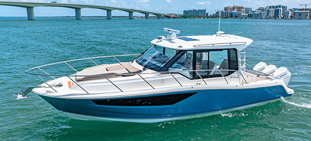 A Boston Whaler 365 Conquest on clear turquoise water.