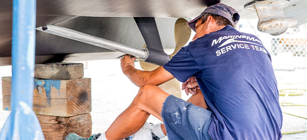 MarineMax service team member working on a boat 