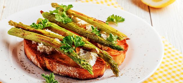 asparagus on bread with garnish