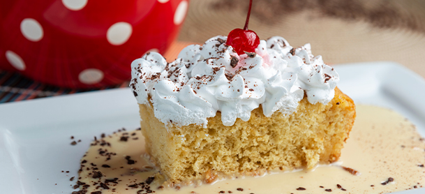 cake with whipped cream and cherry