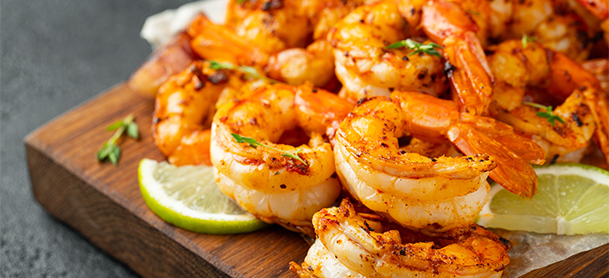 shrimp with lime on a cutting board