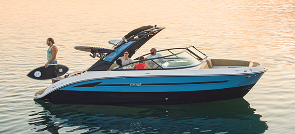 SDX 250 Surf on calm water at sunset, holding four people.