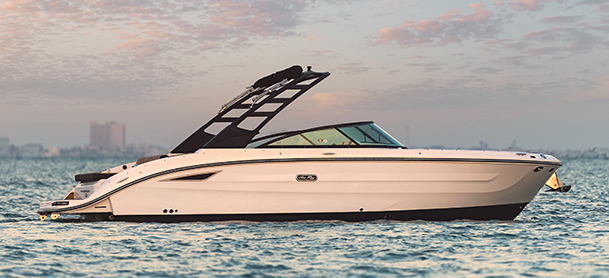 SDX 270 with a black canopy gliding on calm water at dusk, under a pastel sky with soft clouds, evoking a serene, luxurious vibe.