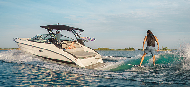 Sea Ray 260 SLX with person wake surfing behind