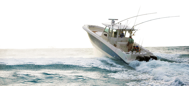 fishing boat soaring through air after tearing through large wave