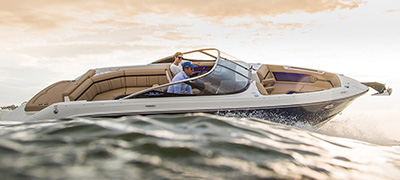 Water view of a boat cruising through waves