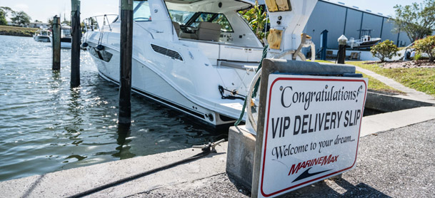 boat parked in the VIP Delivery Slip. A sign reads 'Welcome to your dream'