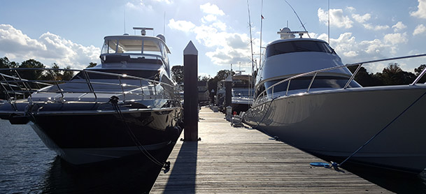 several boats lined up along a dock