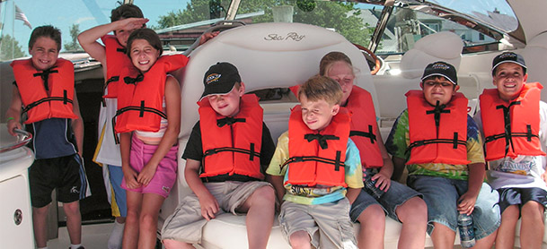 group of kids in life jackets