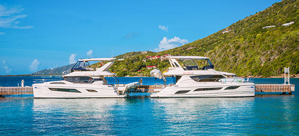 Two MarineMax Vacations power catamarans docked in the British Virgin Islands 