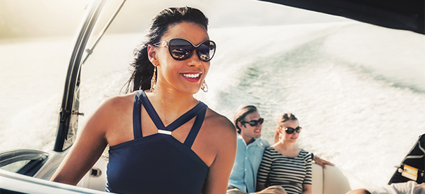 A woman piloting a boat on the water