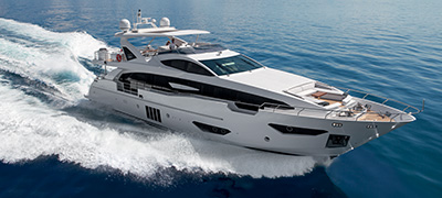 MarineMax white Yacht cruising through the ocean.