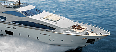 Couple sunbathing on a yacht.  