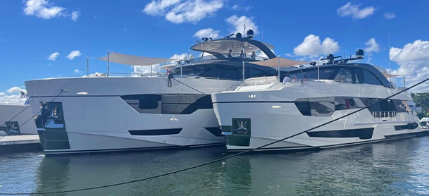 Two yachts on the water at the Miami International Boat Show