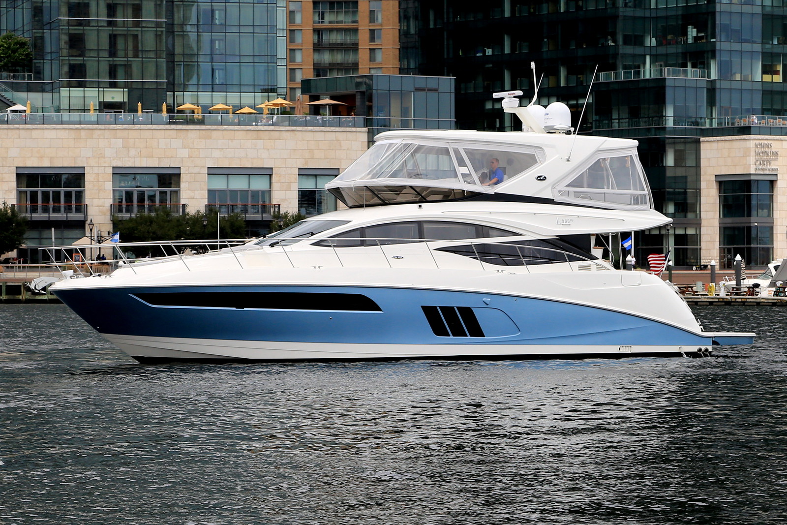 yacht in front of buildings