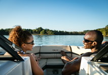 couple on sport boat