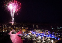 fireworks above boats in marina