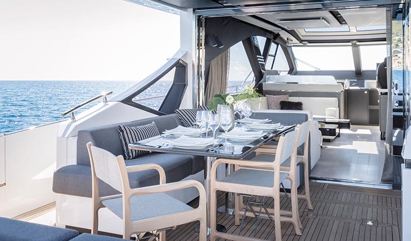 a dining table on the deck of a yacht